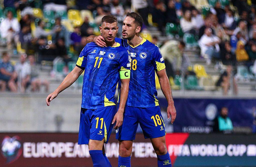 Edin Dzeko and Nikola Kati chat during Bosnia-Herzegovina's World Cup qualifying match against Cyprus in October