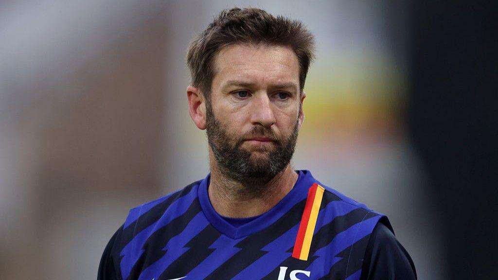 Andrew Tye looks on