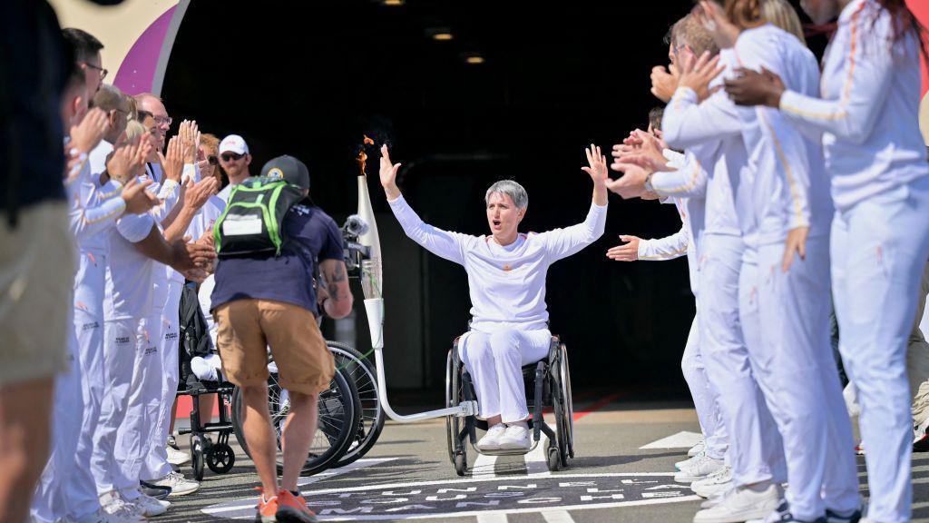 The Paralympic torch is carried through the Channel Tunnel