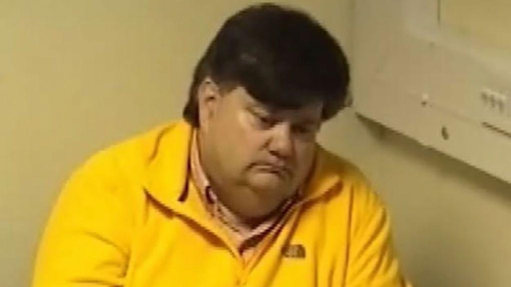 Carl Beech. He has short brown hair and is wearing a yellow top.