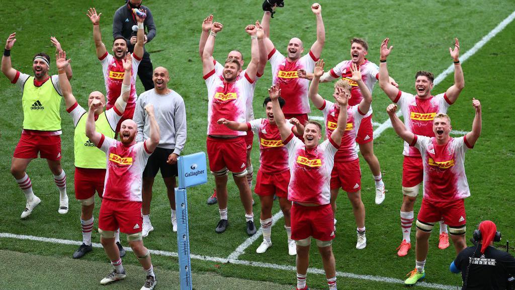 Harlequins players salute their fans high in the Ashton Gate stands after an astonishing 43-36 extra-time victory over Bristol in 2021