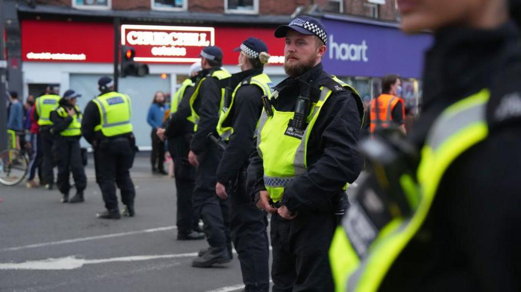 police standing in the road. 