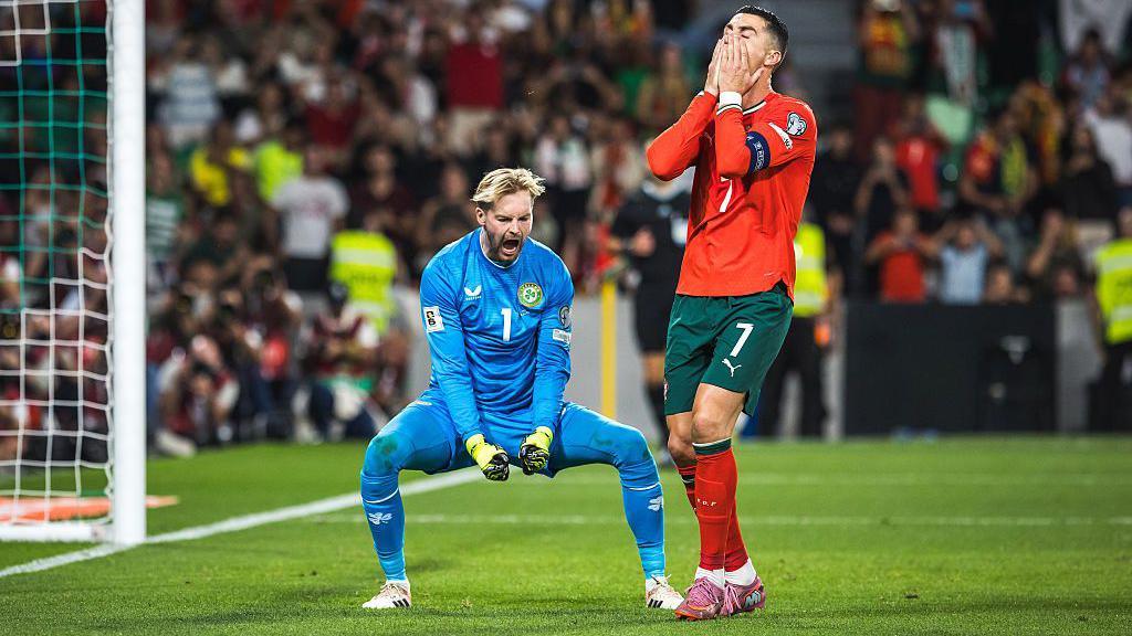 Caoimhin Kelleher celebrates saving Cristiano Ronaldo penalty