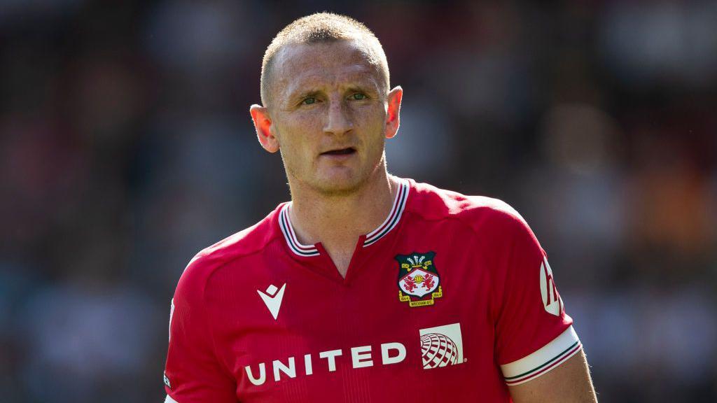 Will Boyle in action for Wrexham