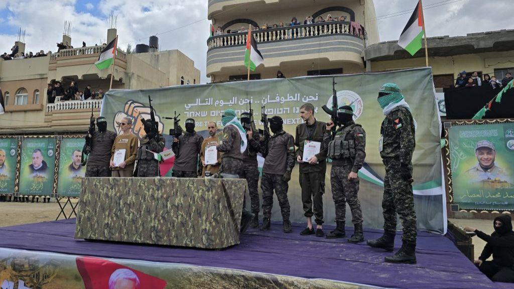 Israeli hostages Or Levy, Eli Sharabi, and Ohad Ben Ami being handed over to the International Committee of the Red Cross