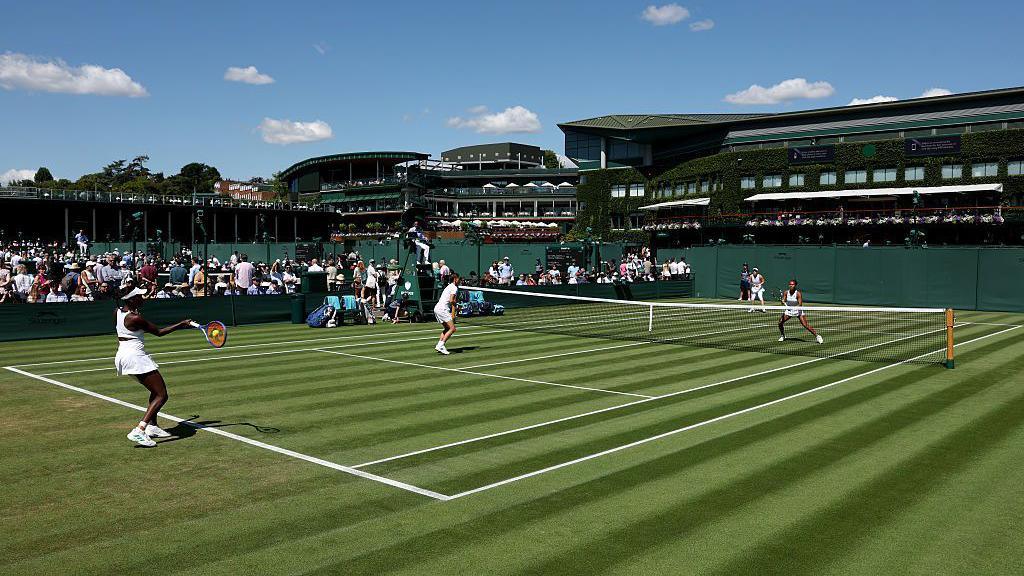 A doubles match played at court 11 at Wimbledon