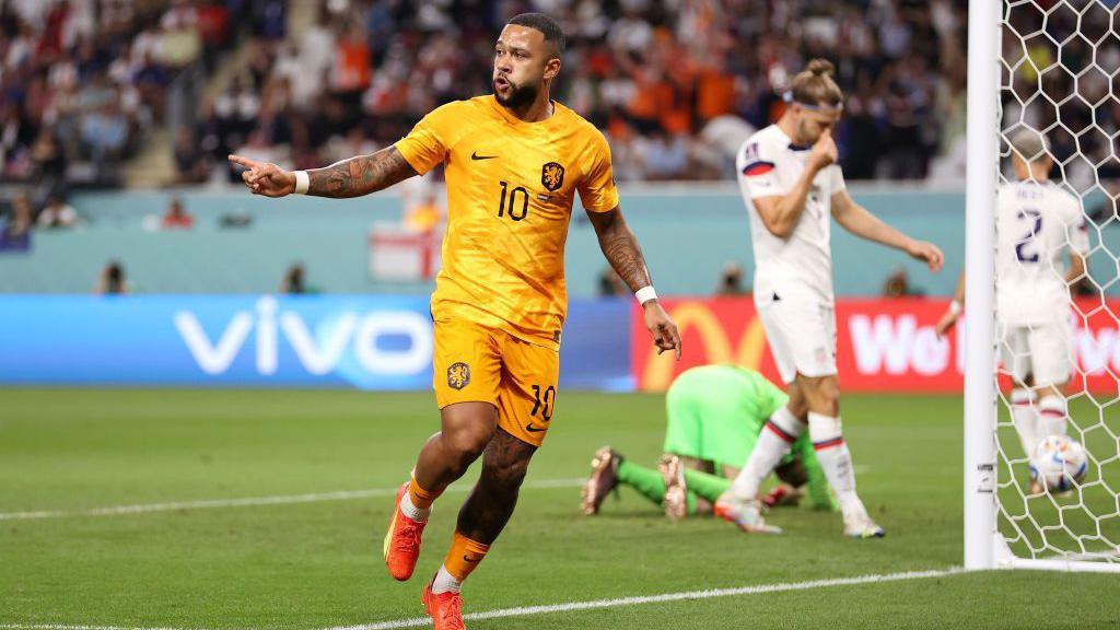 Memphis Depay celebrates while playing for the Netherlands