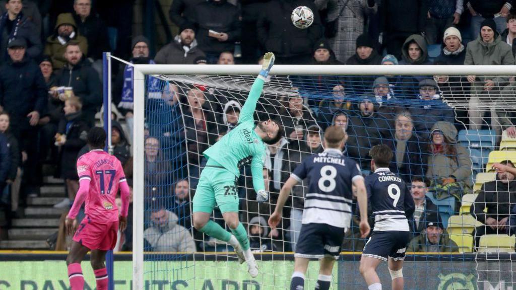 Joe Wildsmith saves from Jake Cooper's header