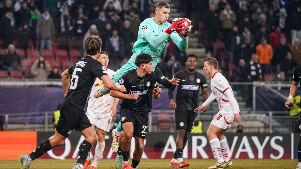 Goalkeeper Kjell Scherpen of Sturm Graz catches the ball during a Champions League game against RB Leipzig.
