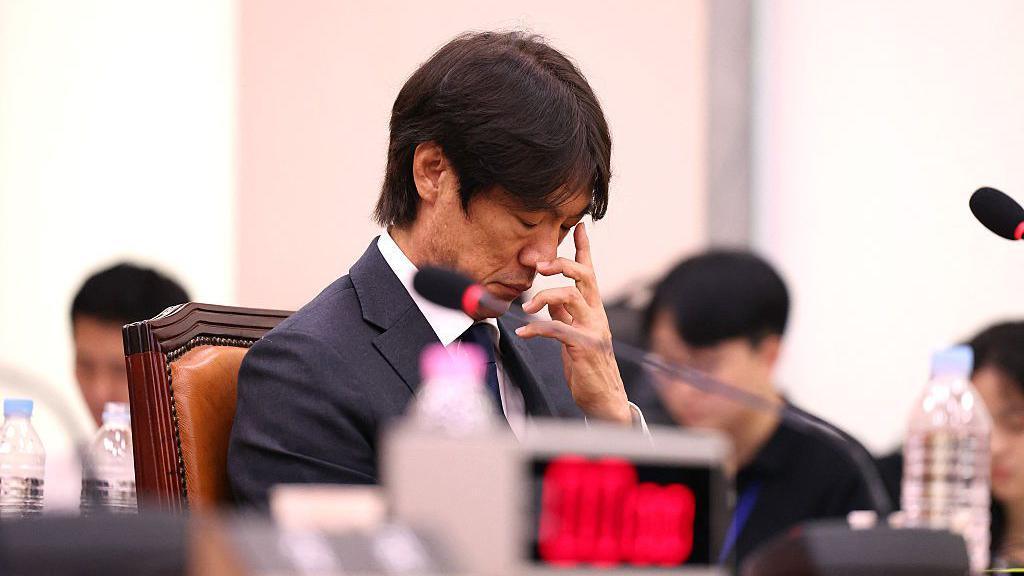 Former South Korea football manager Hong Myung-bo looks down with his eyes closed during a parliamentary hearing into his appointment in 2024