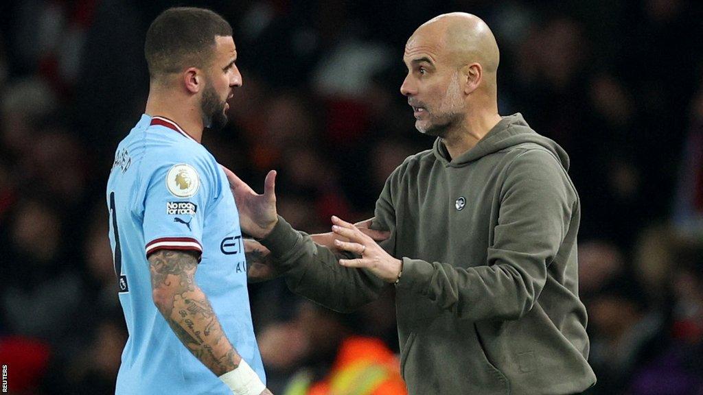 Kyle Walker talking to Pep Guardiola during a match