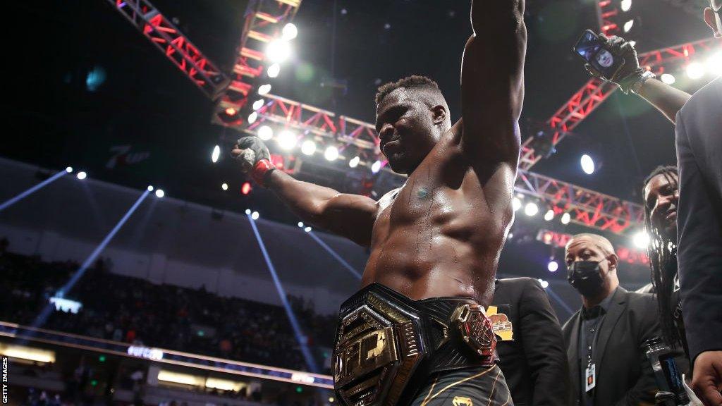 Francis Ngannou with his UFC belt around his waist