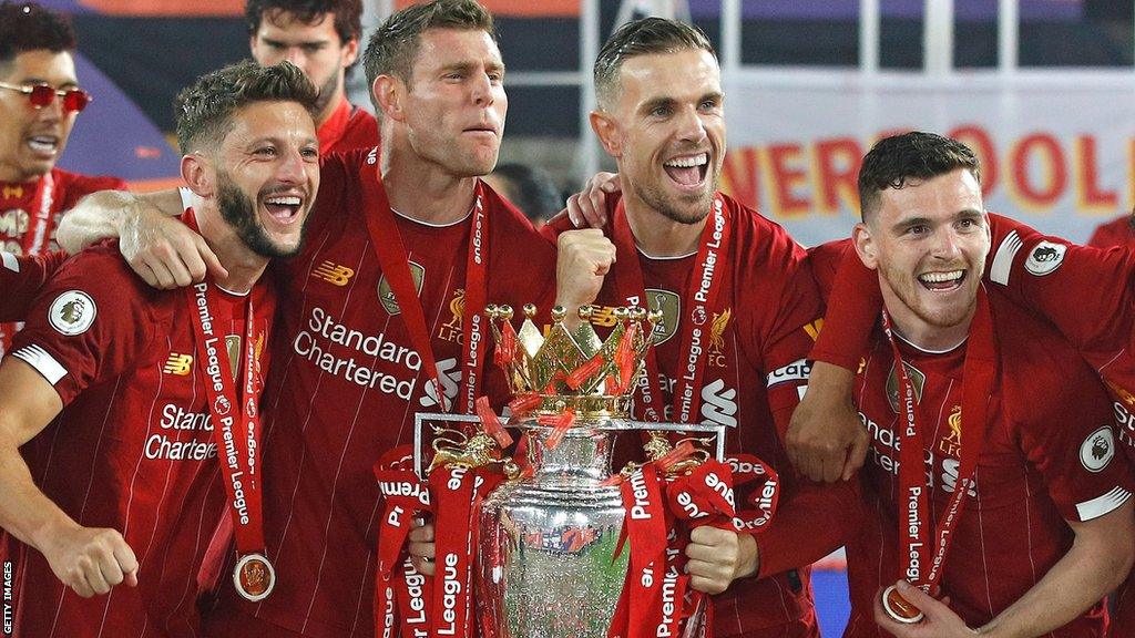 Adam Lallana (left), James Milner (second left), Jordan Henderson (second right) and Andy Robertson (right) celebrate Liverpool winning the 2019-20 Premier League title