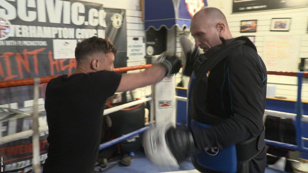 Danny Baker hits pads with Steve Kipps