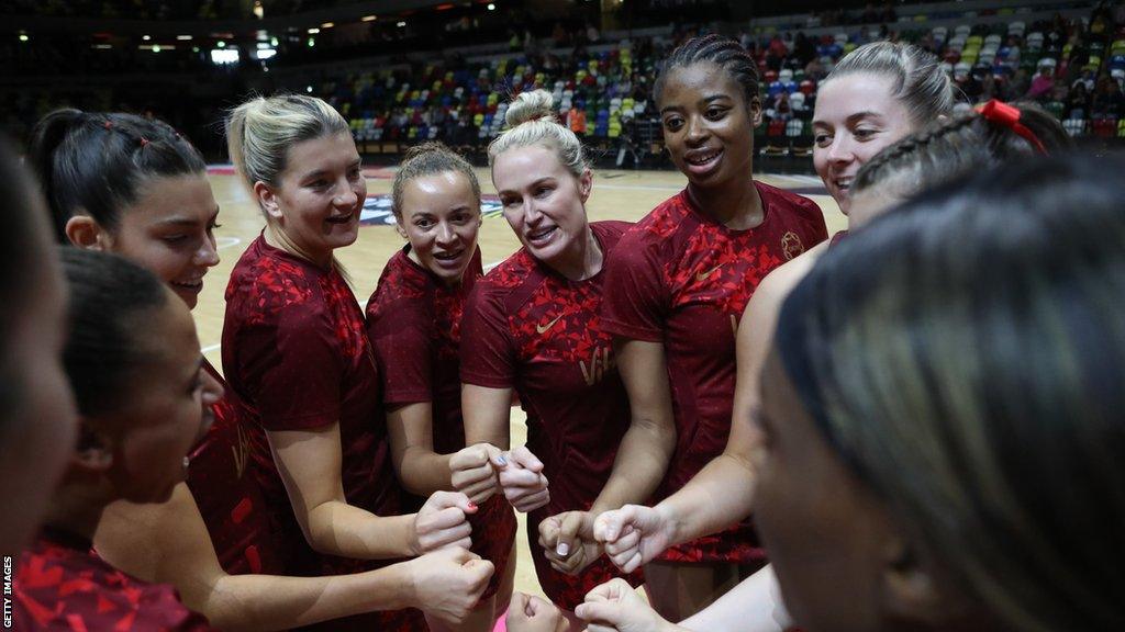 England Roses in huddle