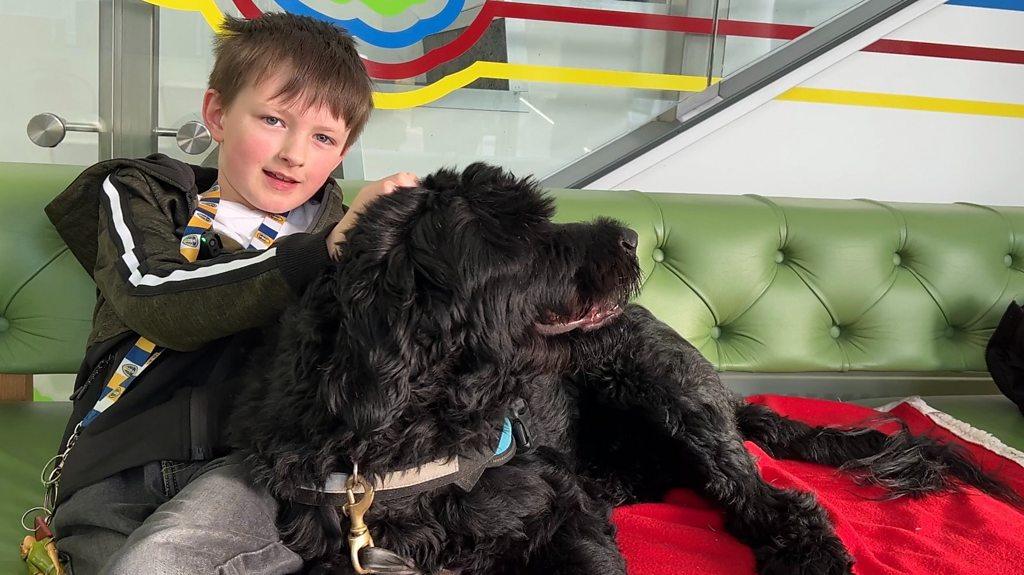 Joseph with his assistance dog Shadow