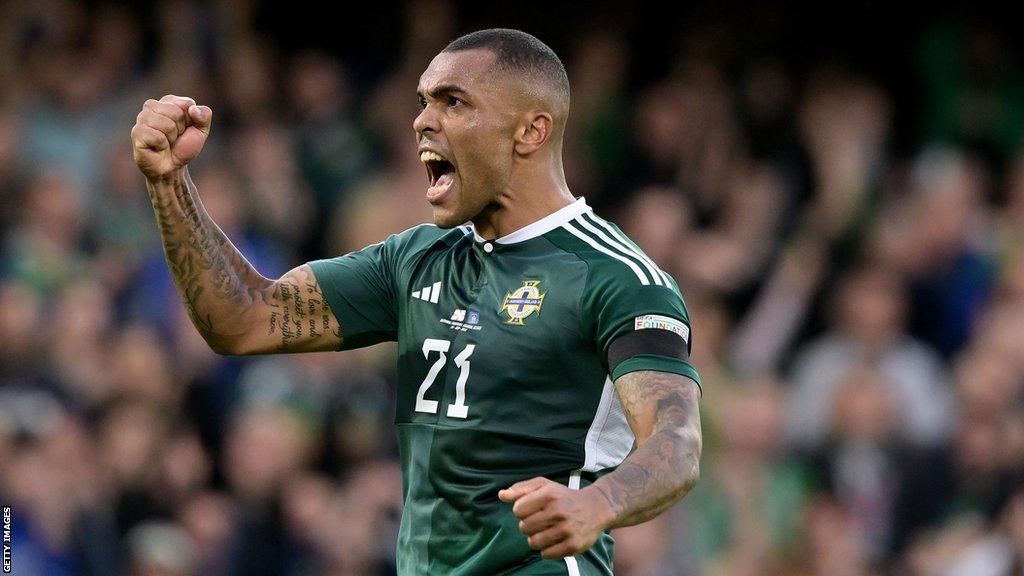 Josh Magennis celebrates while playing for Northern Ireland