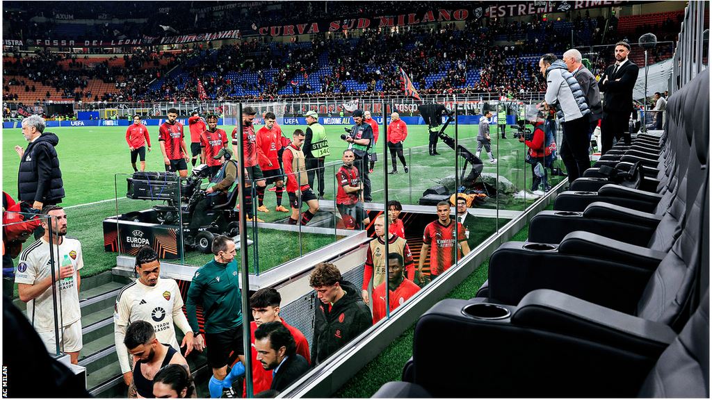 View from the seats with the players walking down the tunnel at half-time