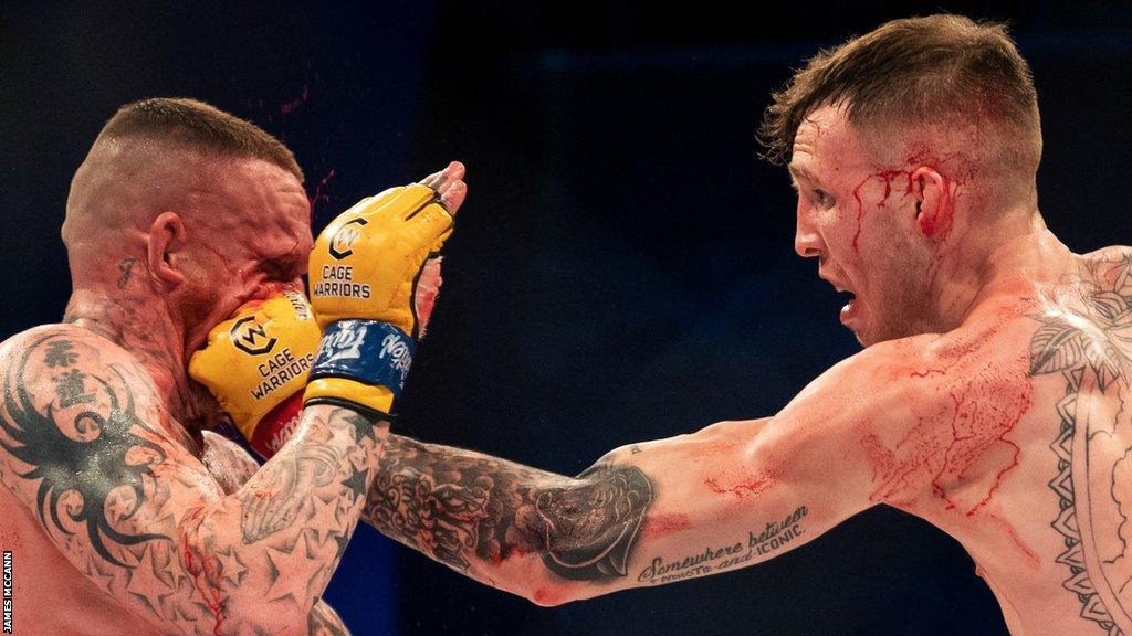 Jimmy Wallhead is struck by a Rhys McKee punch in Saturday night's welterweight fight