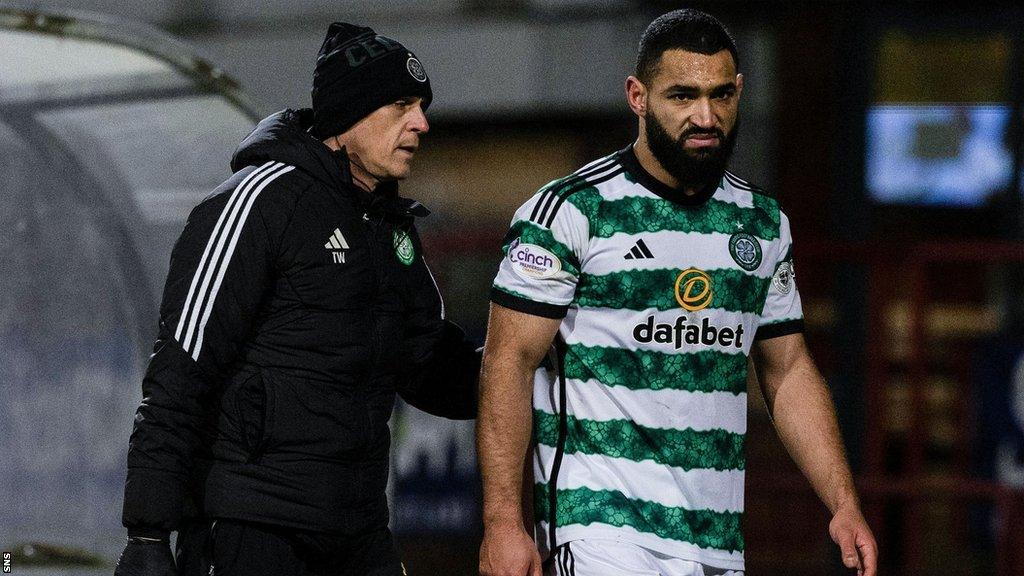 Celtic centre-half Cameron Carter-Vickers (right) goes off injured against Dundee