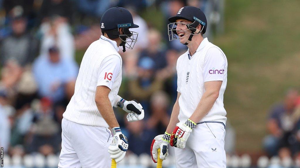 Harry Brook and Joe Root smile