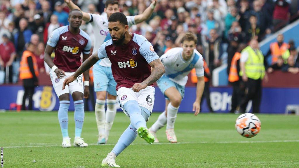 Douglas Luiz scores a penalty