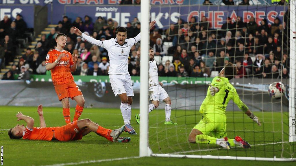 Swansea's Joel Piroe celebrates after Callum Connolly scores what proved to be a decisive own goal