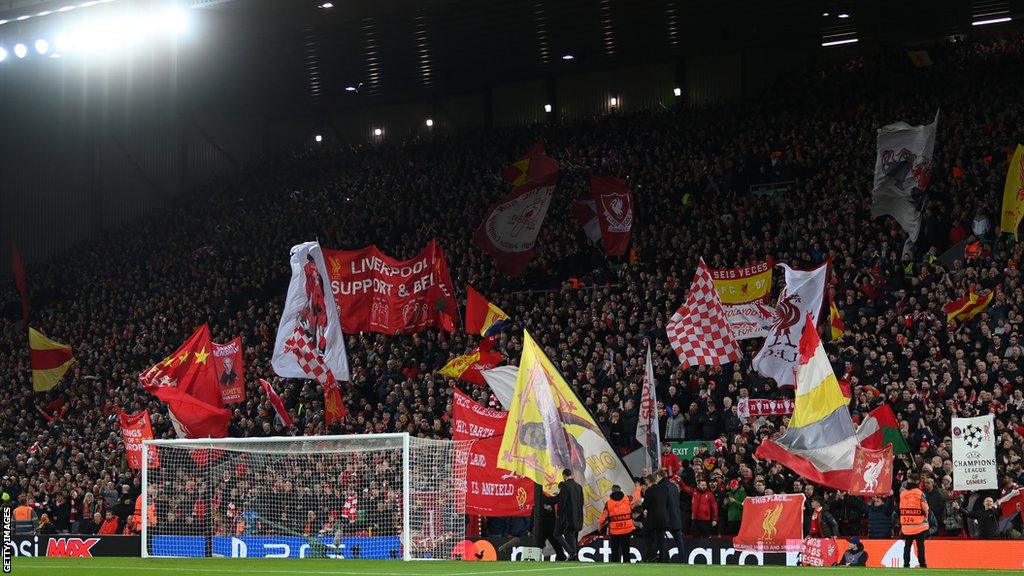 Liverpool fans flying flags on the Kop