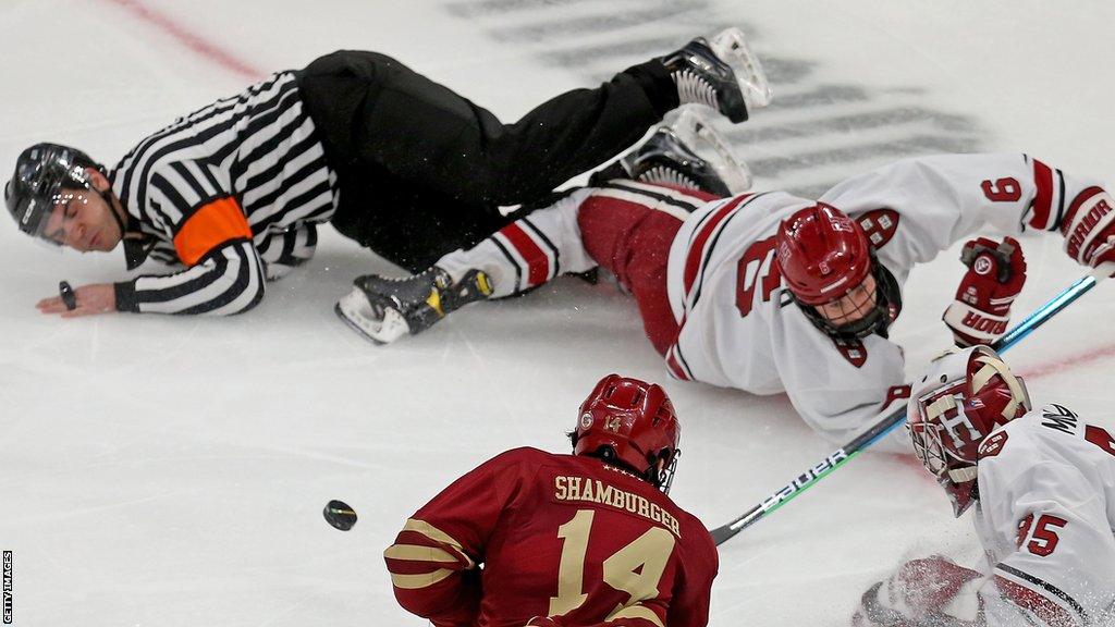 John Fusco collides with a referee while playing for Harvard