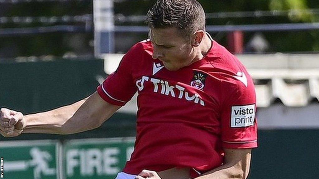 Paul Mullin celebrates a goal for Wrexham