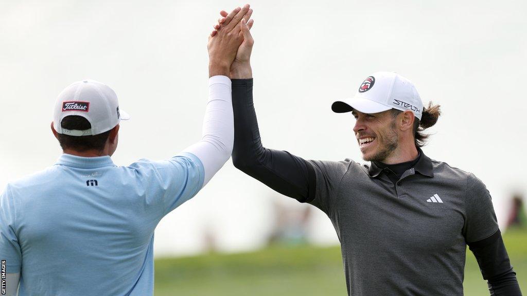 Gareth Bale celebrates a shot with playing partner Joseph Bramlett