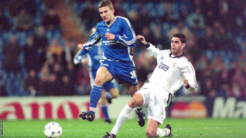 Andriy Shevchenko evades a challenge by Fernando Hierro