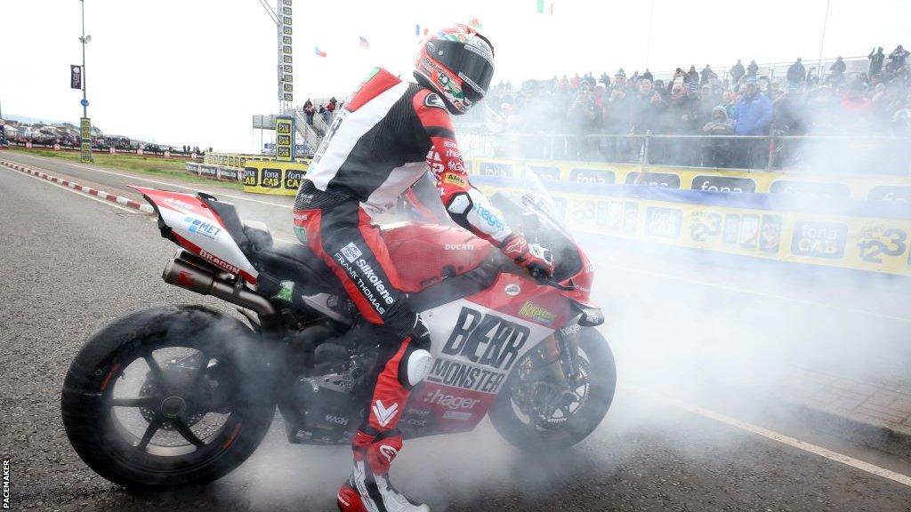 Glenn Irwin celebrates winning the second Superbike race