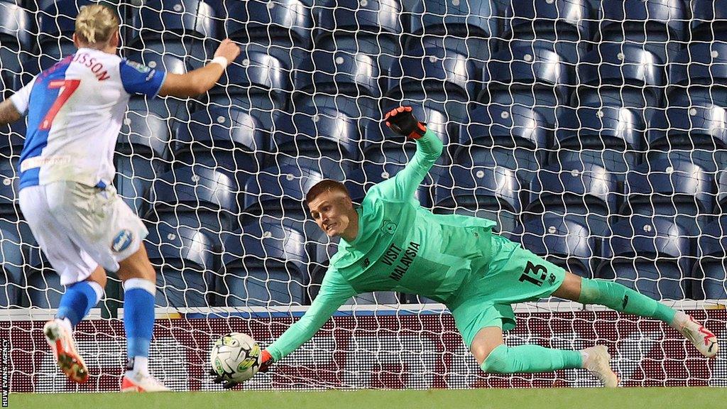 Goalkeeper Alex Runarsson of Cardiff saves a penalty from Arnor Sigurosson of Blackburn Rovers