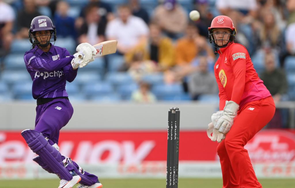 Sarah Taylor looks on as Superchargers Jemimah Rodrigues bats