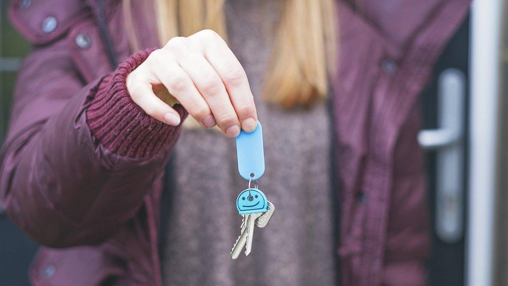 Woman holding keys