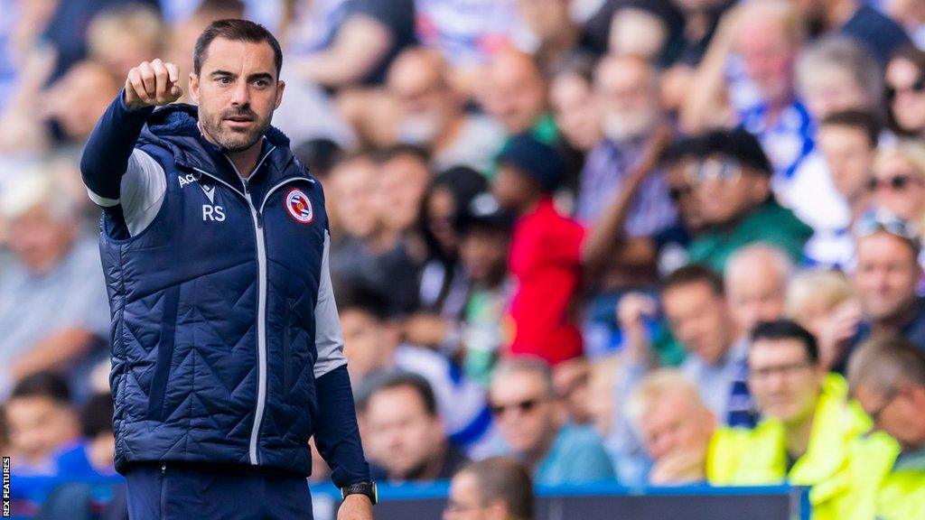 Reading boss Ruben Selles instructs players on the pitch from the touchline