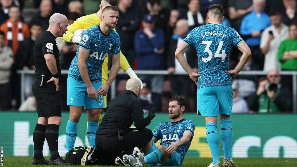 Ben Davies is treated on the pitch at Southampton