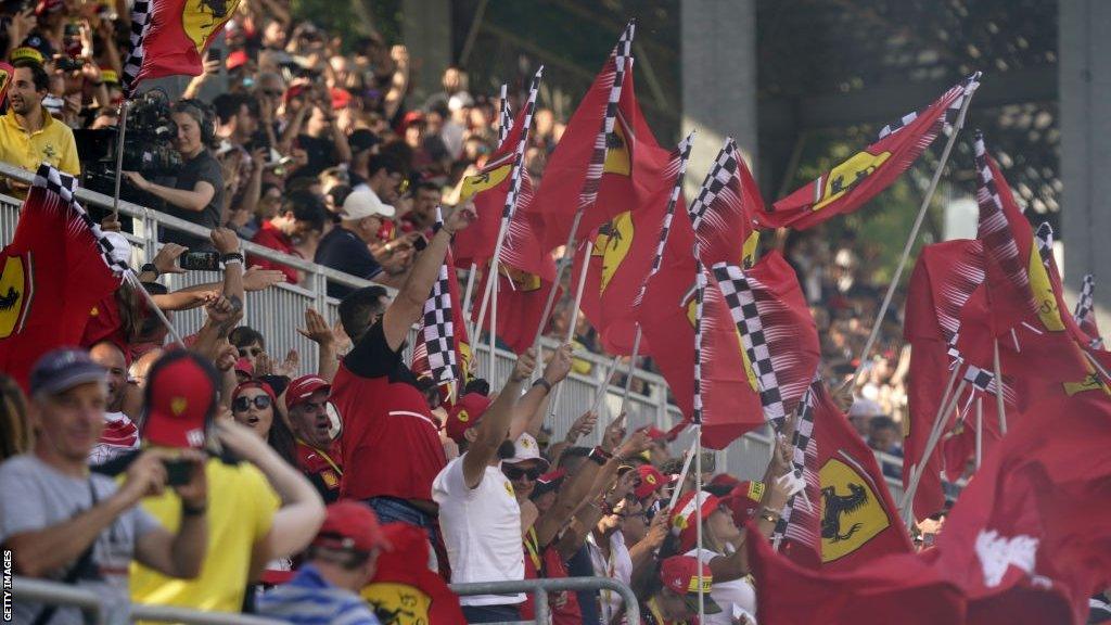 Ferrari flags are flown by the tifosi in the grandstands at Monza