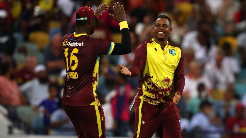 Shimron Hetmyer (R) and Romario Shepherd (L) of West Indies celebrate a wicket