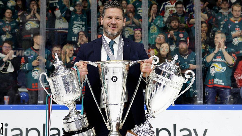 Adam Keefe with the Giants' three trophies last season