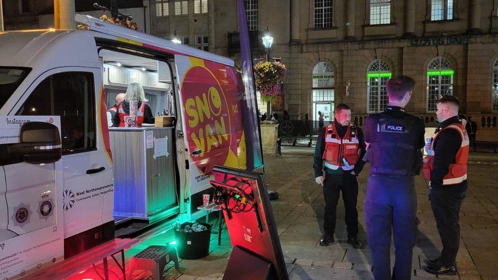 Northampton Guardians standing next to the SNO Van with a police officer