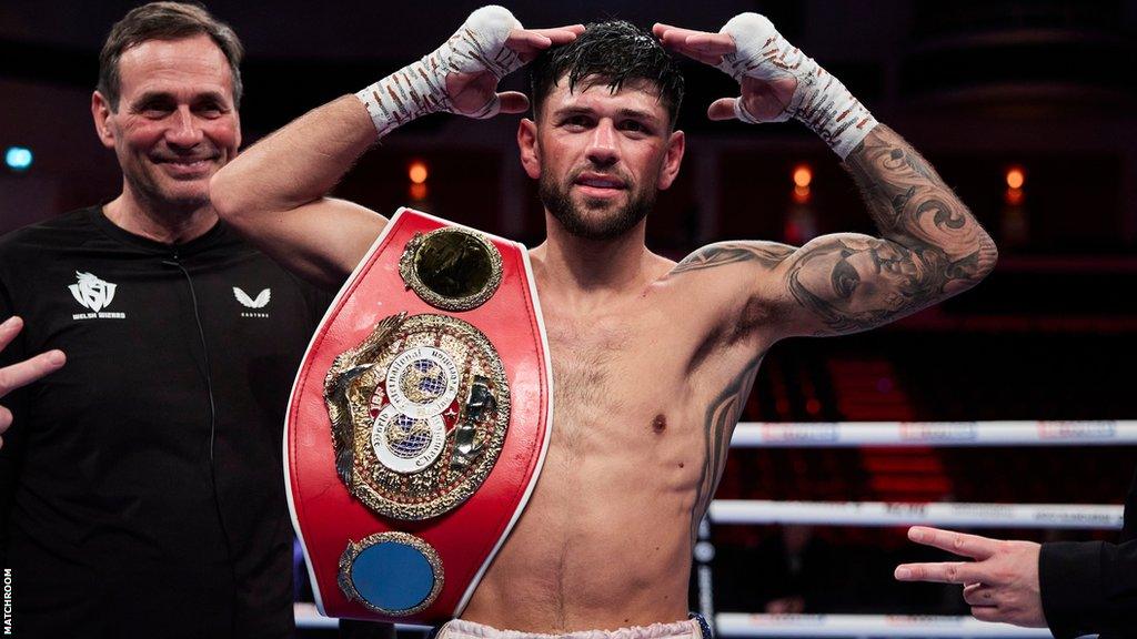 Joe Cordina with his world title on his shoulder in the ring