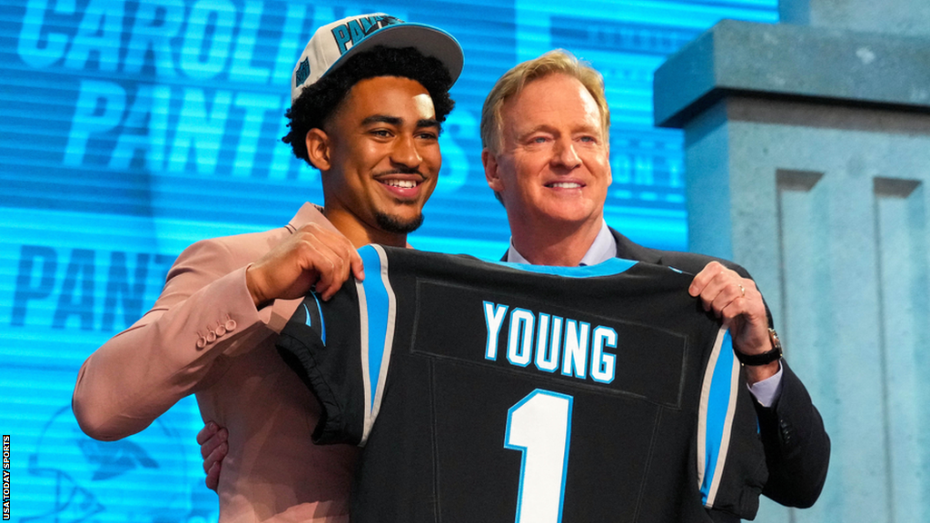 Bryce Young on stage with NFL commissioner Roger Goodell after being selected first in the 2023 NFL draft