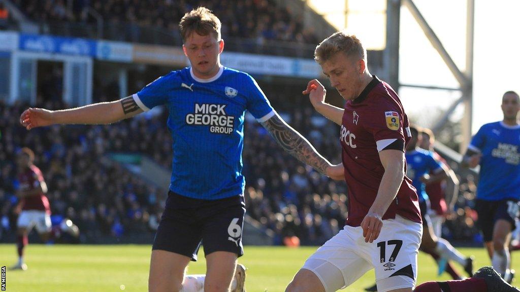 Frankie Kent (left) in action for Peterborough United