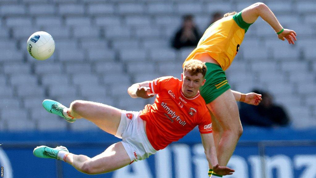 Armagh forward Conor Turbitt and Donegal's Caolan McColgan collide during Sunday's decider