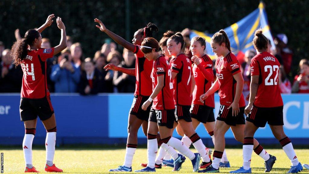 Manchester United celebrate after Melvine Malard scores