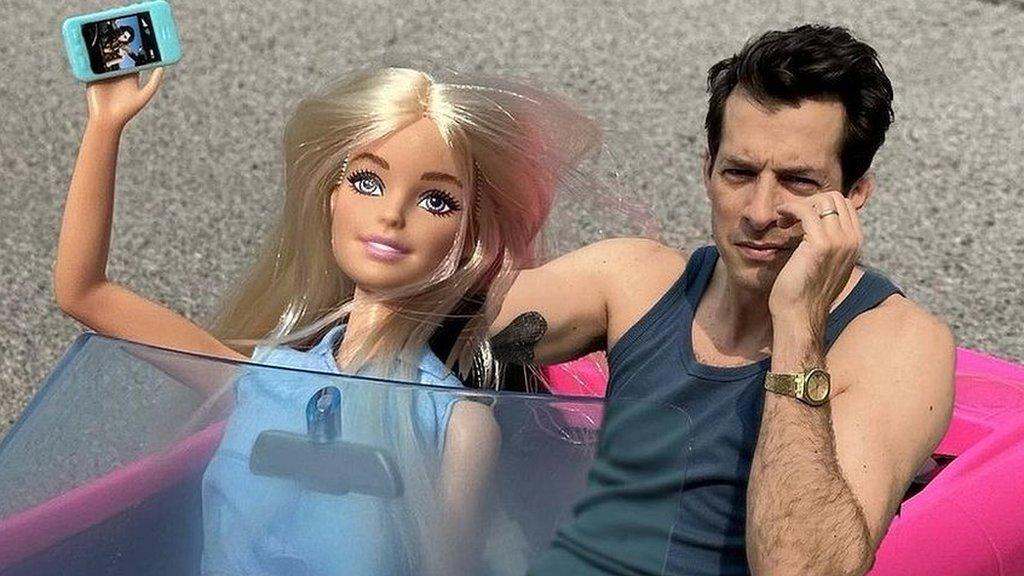 Promotional photo showing Mark Ronson photoshopped into Barbie's car