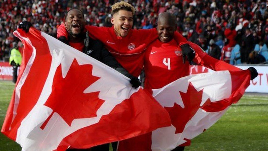 Canada players celebrate after qualifying to the World Cup