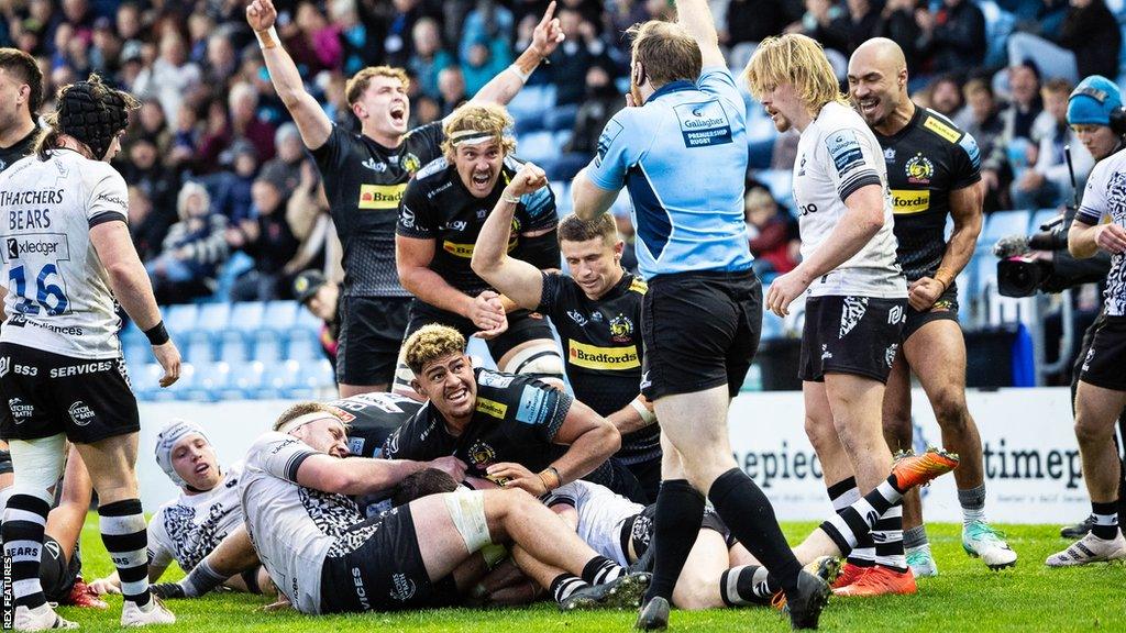 Exeter celebrate scoring their fourth try